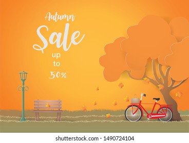 Autumn  sale banner with Red bicycle under the tree in autumn invitation, poster, web site or greeting card. background,paper craft and illustration.
