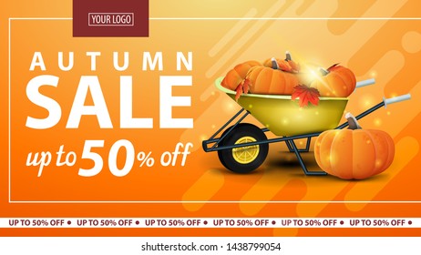 Autumn sale, discount horizontal web banner for online store with garden wheelbarrow with a harvest of pumpkins and autumn leaves