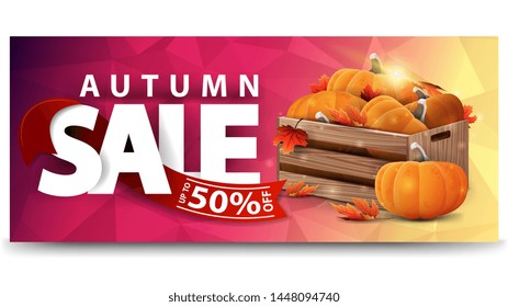 Autumn sale, horizontal discount web banner for your website with wooden crates of ripe pumpkins and autumn eaves