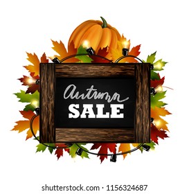 Autumn sale. Autumn leaves are drawn with chalk on a black chalkboard. Sketch, design elements. Vector.