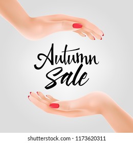 Autumn sale lettering between two hands. Autumn offer or sale advertising design. Handwritten text, calligraphy. For leaflets, brochures, invitations, posters or banners.
