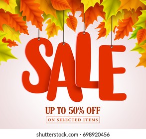 Autumn sale vector design with red sale text hanging in colorful maple leaves for fall seasonal marketing promotion. Vector illustration.
