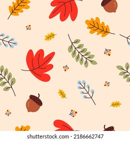 Autumn seamless pattern with acorns , oak leaves and maple in Orange, Beige, Brown, Yellow, Red and Green. autumn greeting cards. Fall season wallpaper, gift paper, pattern fills, web page background.