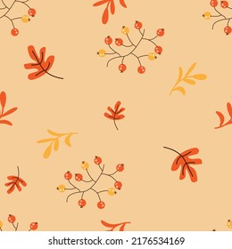 Autumn seamless pattern with cartoon oak leaves and rowan berries.Suitable for wallpaper,textiles,wrapping paper,web page background,postcards.Vector.