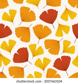 Autumn seamless pattern with colorful ginkgo biloba leaves. Vector illustration on white background. Fall ornament. Foliage print for fabric, package, wrapping, wall art. Red, orange, yellow, colors.