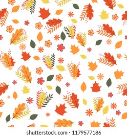 Autumn seamless pattern. Colorful leaves, flowers, and berries isolated on white. Fall theme vector illustration. Background for wedding invitation, greeting card, fabric, banner, gift wrap, etc.