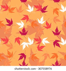 Autumn seamless pattern with colorful maple leaves.