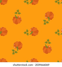 Autumn seamless pattern with colorful orange pumpkins with green leaves. Vector illustration on a yellow background. For packaging design, wrapping paper, printing on paper or fabric.