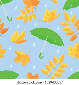 Autumn seamless pattern. Colorful umbrellas, the leaves of rowan falling raindrops on a blue background. Flat cartoon style. Vector graphics