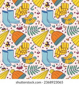 Autumn seamless pattern with cozy elements in doodle style. Vector illustration of warm clothes