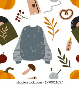 Autumn seamless pattern. Cozy illustration for cards, posters, wrapping paper, scrapbooking, fabric, clothes and other fall design. Hygge home elements, fall essentials: leaves, pumpkin, sweater, etc.