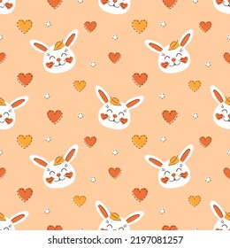 Autumn seamless pattern cute rabbits with fallen leaves and hearts on orange background. White happy bunny. Children vector illustration for fabric, textile, wallpaper