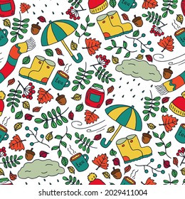 Autumn seamless pattern in the doodle style. Autumn theme: rain, fallen leaves, warm clothes 
and hot tea. A vector image.