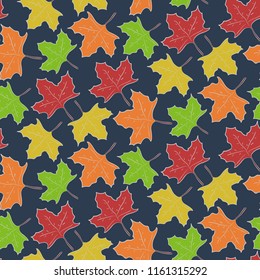 Autumn seamless pattern with falling colorful maple leaves on dark blue background. Nice seasonal fall texture for textile, wrapping paper, cover, wallpaper, surface