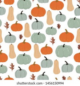 Autumn seamless pattern. Graphic pumpkins and dry leaves. Vector backdrop. Thanksgiving. Halloween. Wrapping paper design template.