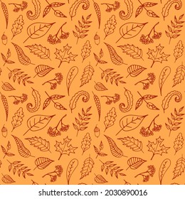 Autumn seamless pattern with hand-drawn leaves on a yellow background. Botanical illustration for fabric or wrapping paper with rowan and acorns.