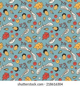 Autumn seamless pattern with leaves, acorns, berries and maple seed pods.