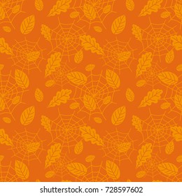 Autumn seamless pattern with leaves and spider web. Halloween design.