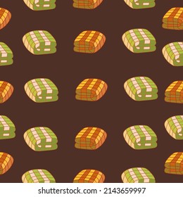 Autumn seamless pattern on a brown background with cozy plaids. Hand drawn autumn blankets. Texture for scrapbooking, wrapping paper, invitations.