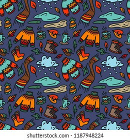 Autumn seamless pattern on dark background. The sweater, scarf, boots, cup of coffee, puddles, clouds, leaves