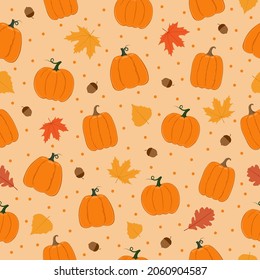 Patrón sin fisuras de otoño. Calabazas, hojas, bellotas y puntos sobre fondo rosado. Antecedentes del diseño decorativo otoñal