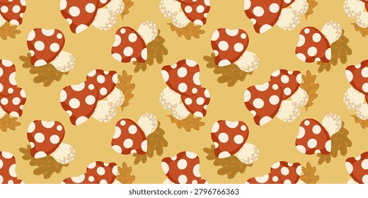 Autumn seamless pattern with red fly agaric mushrooms and oak leaves. Perfect for fall textiles. Seamless pattern featuring stylized red toadstools with white dots and autumn oak leaves on a warm yellow background. Perfect for fall textiles, wrapping paper, and cute cottage core decor.