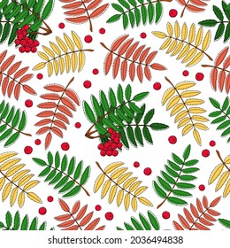 Autumn seamless pattern: rowan leaves and berries. Colored fallen leaves. A vector image.