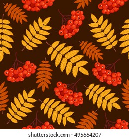 Autumn seamless pattern with rowan leaves and berries. Vector illustration on brown background.