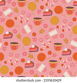 Autumn seamless pattern with tea, yarn, woolen socks, flowers, pumpkin pie on pink background. Perfect for greeting card, wallpaper, wrapping paper, fabric. Vector illustration