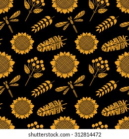 Autumn seamless pattern. Thanksgiving Day repeatable background. Feathers, dragonflies, sunflowers, spikes, branches with rowan berries and leaves