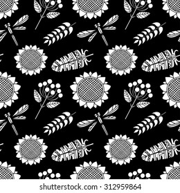 Autumn seamless pattern. Thanksgiving Day repeatable background. Feathers, dragonflies, sunflowers, spikes, branches with rowan berries and leaves