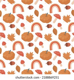 autumn seamless pattern with vivid pumpkin, stylized rainbow, yellow leaves and mushrooms
