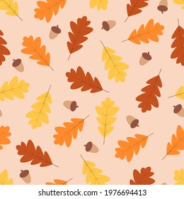 Autumn seamless pattern, yellow and red oak leaves and acorns fall in autumn.