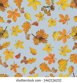   Autumn seamless patterns in the form of leaves of orange, yellow, red oak, chestnut, acorns, on a blue background for wrapping paper, fabric, wallpaper.
				