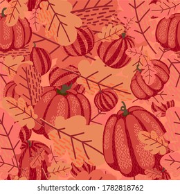 autumn seamless vector pattern of pumpkins and oak leaves in peach colors