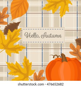 Autumn season background with pumpkin, yellow leaves and plaid fabric. Hello autumn