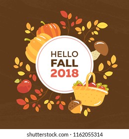 Autumn seasonal banner with the text "Hello fall 2018". White circle with insription on wooden texture with fall harvest symbols and branches with red and yellow leaves. Autumn poster.