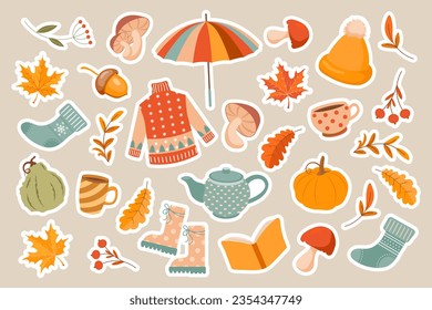 Autumn set of cozy stickers. Sweater, socks, pumpkins, mountain ash, mushrooms, umbrella, autumn leaves, tea, rubber boots. Design elements. Vector