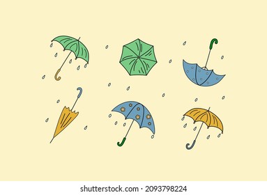 Autumn set in the style of doodle. Multi-colored umbrellas, rain. Cartoon set of umbrellas. Vector illustration. Isolated background.