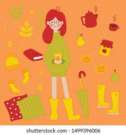 Autumn set with a young red-haired girl in a large warm sweater and glasses. A young girl holds latte pumpkin coffee to go. Around her cozy things. Books, pillows, apple jam, tea, bakery, warm clothes