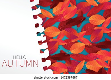 Autumn template with red and orange leaves on a blue background with a torn out sheet of note pad paper. Vector illustration.
