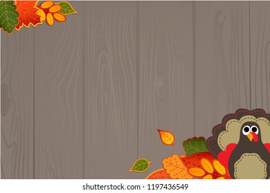 Autumn thanksgiving design on wood background with turkey and leaves.