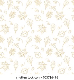 Autumn, thanksgiving, fall seamless gold outlined pattern with oak, maple and other autumn leaves, acorns, briar on white background. For holiday invitations, greeting cards,  banners, posters, flyers