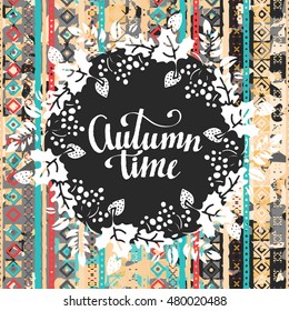 Autumn time card. Frame. Leaves, flowers, berries. Ethnic background. Calligraphic text, handwritten
