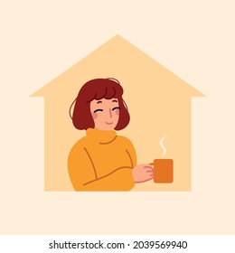 Autumn time. Girl sitting at home and drinking a hot drink. Self-isolation during a pandemic.