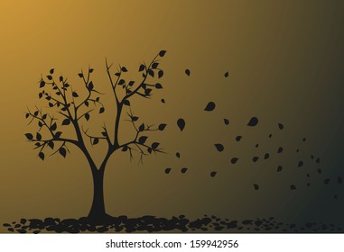 Autumn tree with falling down leaves.