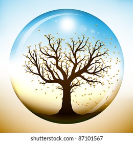 Autumn tree with falling yellow leaves, closed inside a glass sphere