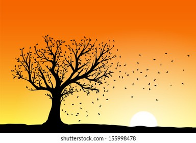 Autumn Tree Silhouette In Sunset, Wind Blowing Away The Falling Leaves