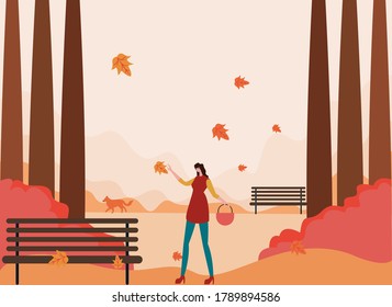 Autumn vector concept: Happy woman with falling autumn leaves in the garden