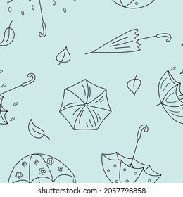 Autumn vector pattern. Hand drawn umbrellas in doodle style on a light blue isolated background.